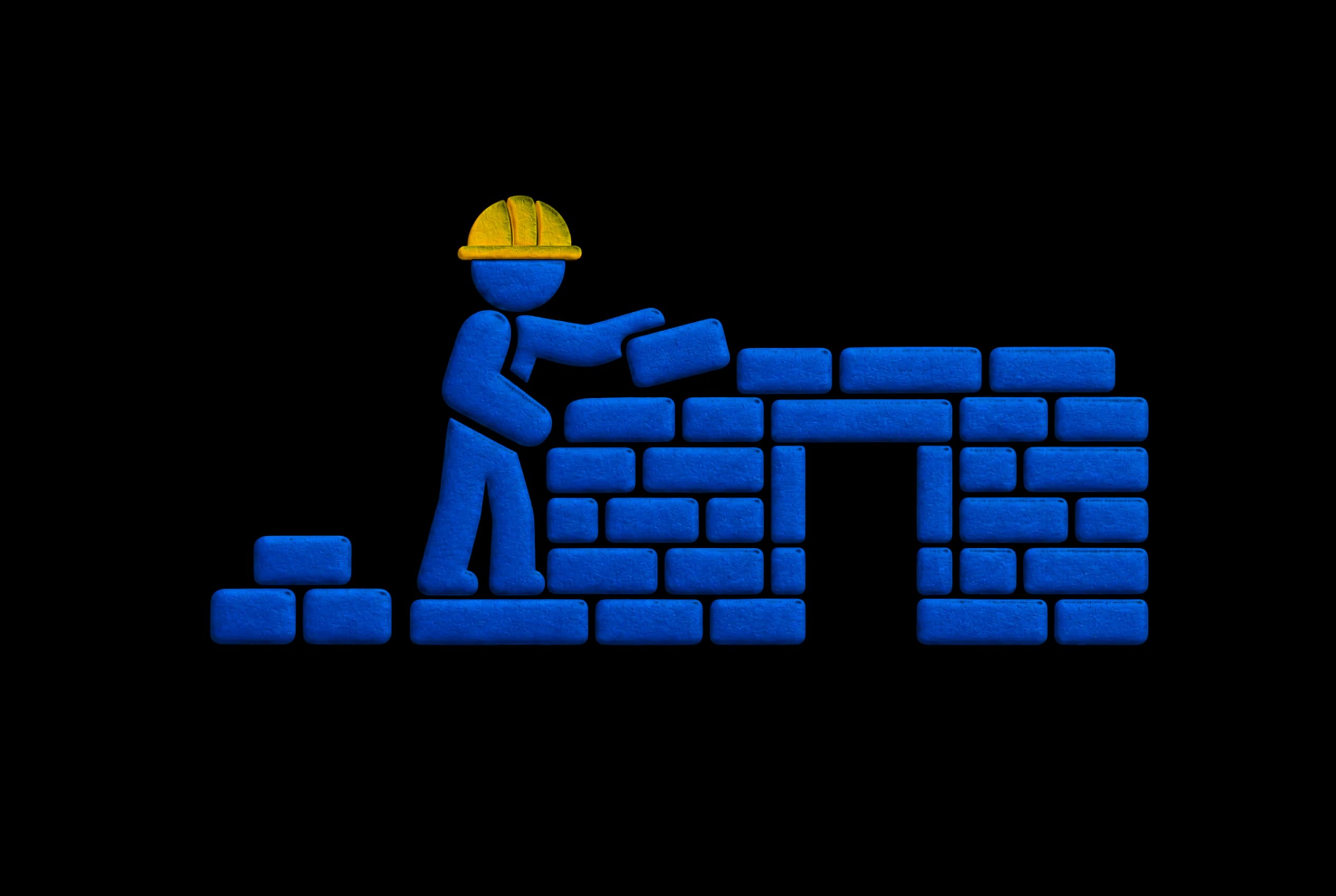 Pressed-paper illustration in deep blue on warm paper: a builder in a yellow hard hat laying the next brick on a wall going up.